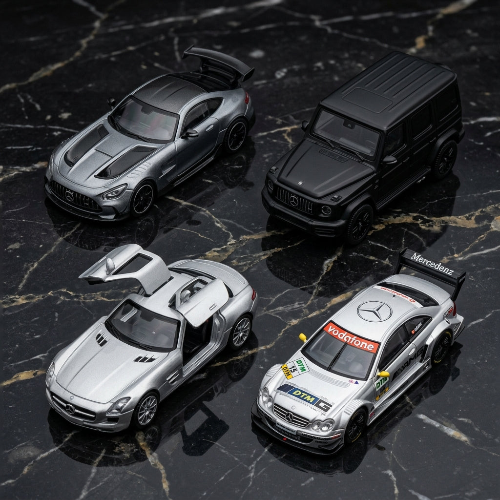 Mercedes-Benz diecast model cars — AMG GT Black Series, G-Class, SLS AMG with gull-wing doors and DTM CLK on marble