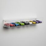 Wall mount display shelf holding a row of 1:64 diecast cars